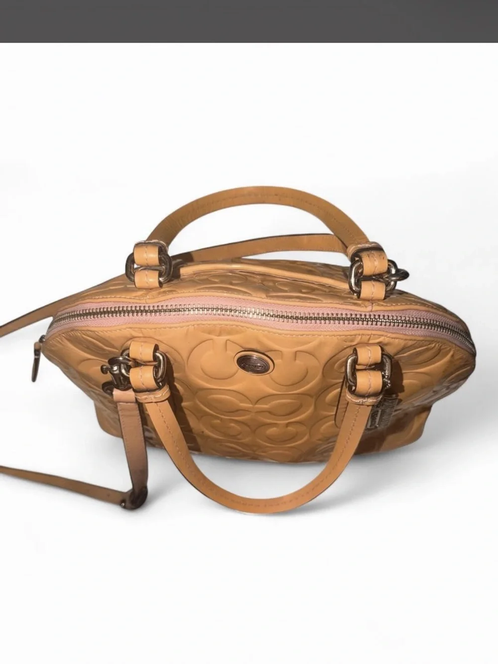 Coach - Peyton Cora in Tan Glossy PVC crossbody with a metallic finish